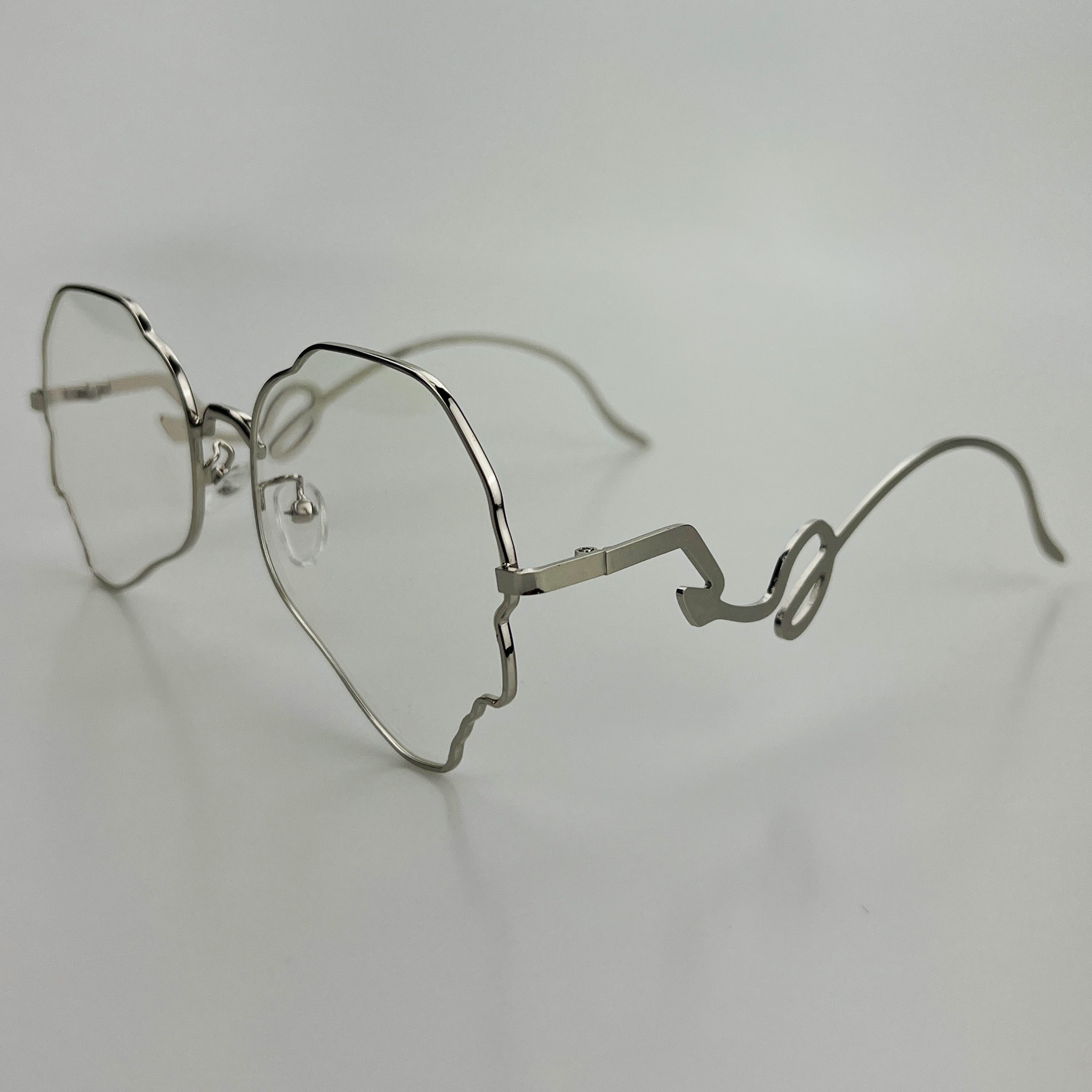 картинка Очки прозрачные тонкая оправа профиль лицо человека изогнутые дужки от магазина LonnaMag