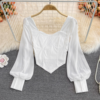 Картинка Топ корсет акцент швы на груди длинный объемный рукав манжеты  от магазина LonnaMag