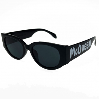 Очки овальной формы срезаны по бокам пластик оправа на дужке надпись Mc Queen